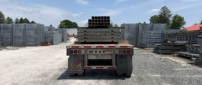 Flatbed freight planning for commercial cargo requiring open deck transportation