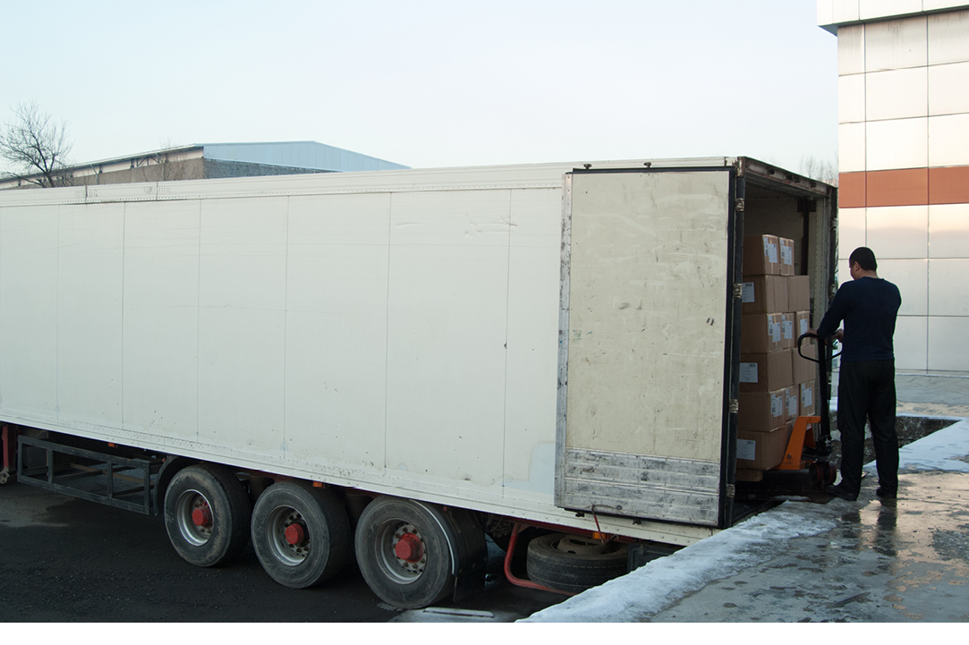 Dock worker loading a semi