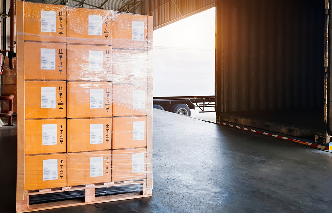 Palletized load about to be put on a semi truck