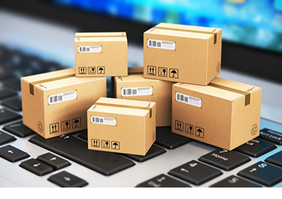 Boxes on a keyboard that represent the tech side of logistics and load transport at Buchanan.