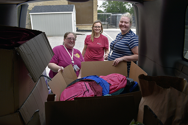 Buchanan Team starts unloading at Adams Elementary School