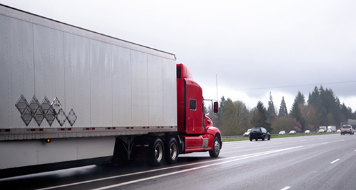 Semi-truck and trailer transporting food and beverage freight coordinated by Buchanan Logistics.