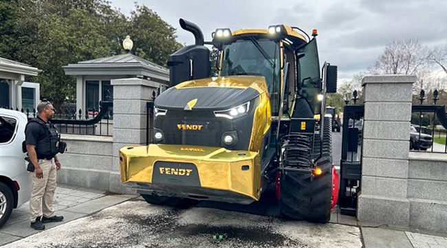 Golden Fendt tractor moving through security at the White House.