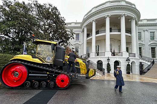 Fendt tractor sitting out front of the white house.