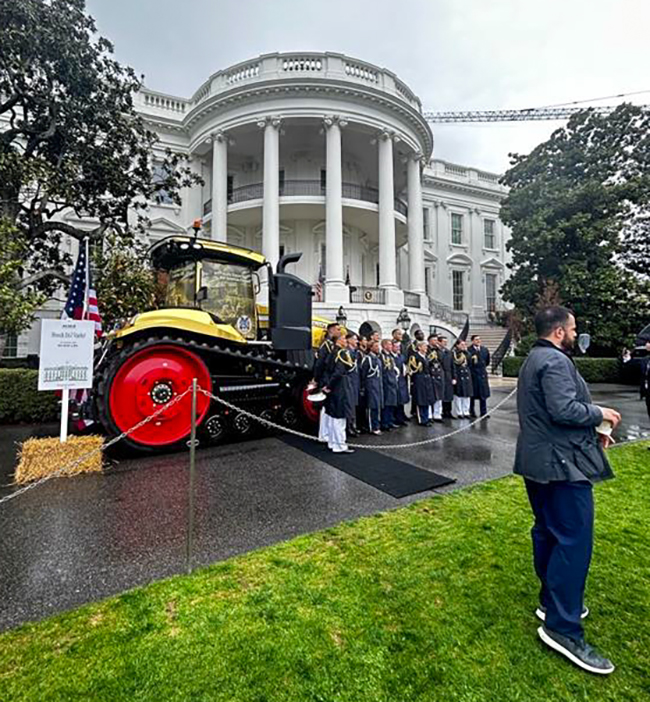 Fendt tractor sitting out front of the white house.
