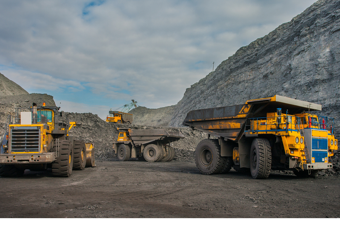 Mining equipment ready to move earth after being delivered on time to the jobsite by Buchanan.