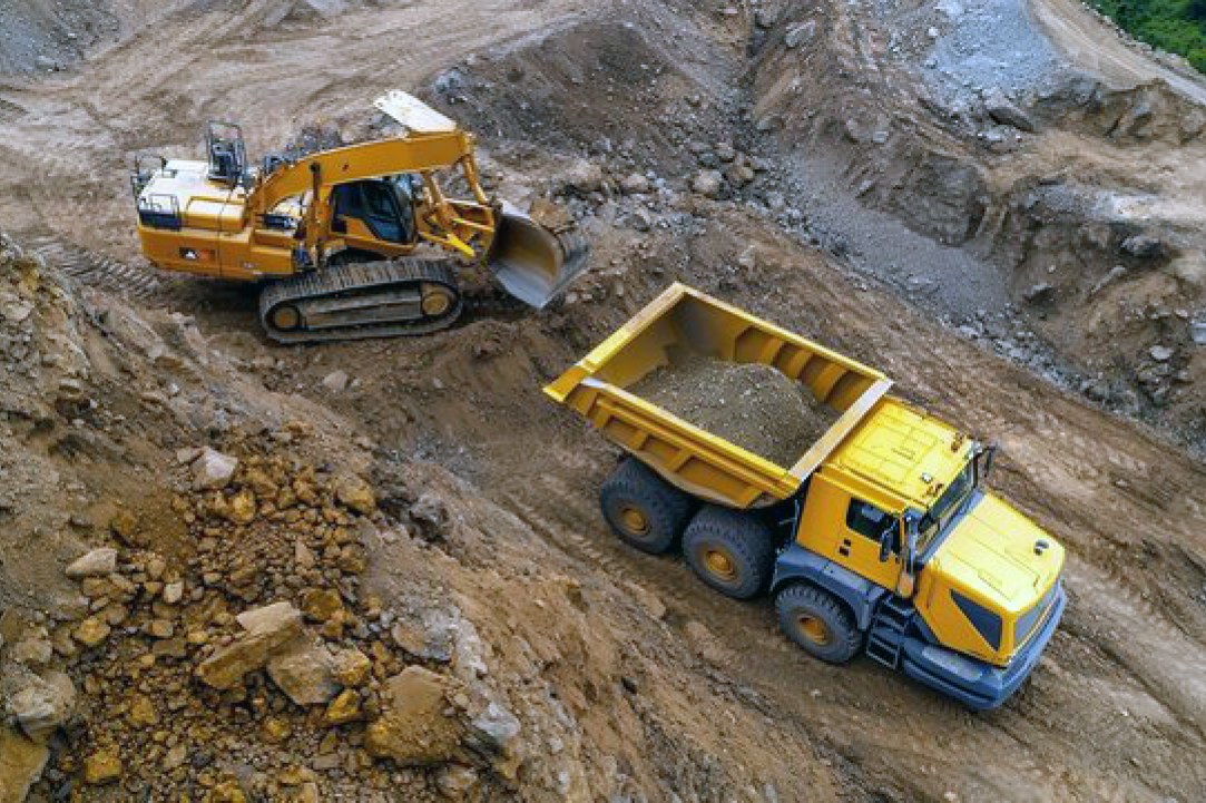 Mining equipment finishing up moving earth before being loaded up and transported to their next jobsite by Buchanan Logistics.