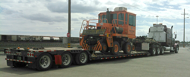 Buchanan Logistics transporting equipment for a customer on their stepdeck trailer.