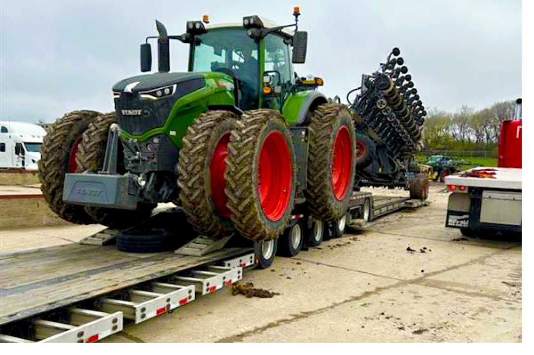 Buchanan Logistics moves farm ag tractor using their RGN trailer.