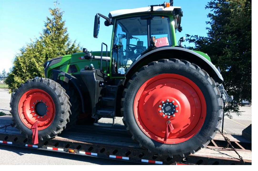 Buchanan Logistics moving a farm tractor to it's new location.