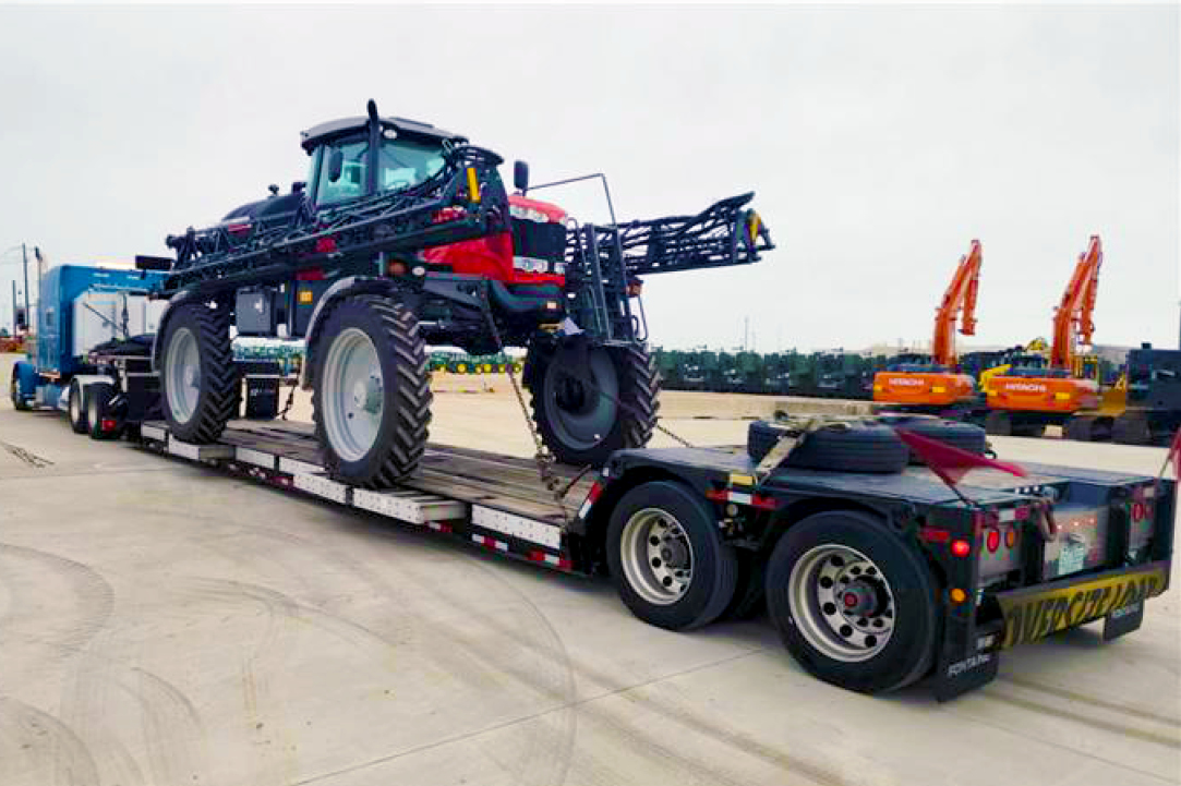 Buchanan Logistics moving an agricultural sprayer.