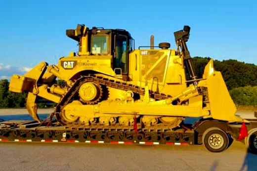 Buchanan Logistics uses their heavy haul trailer to transport construction equipment and materials to a jobsite. Buchanan Logistics uses their heavy haul trailer to transport construction equipment and materials to a jobsite.