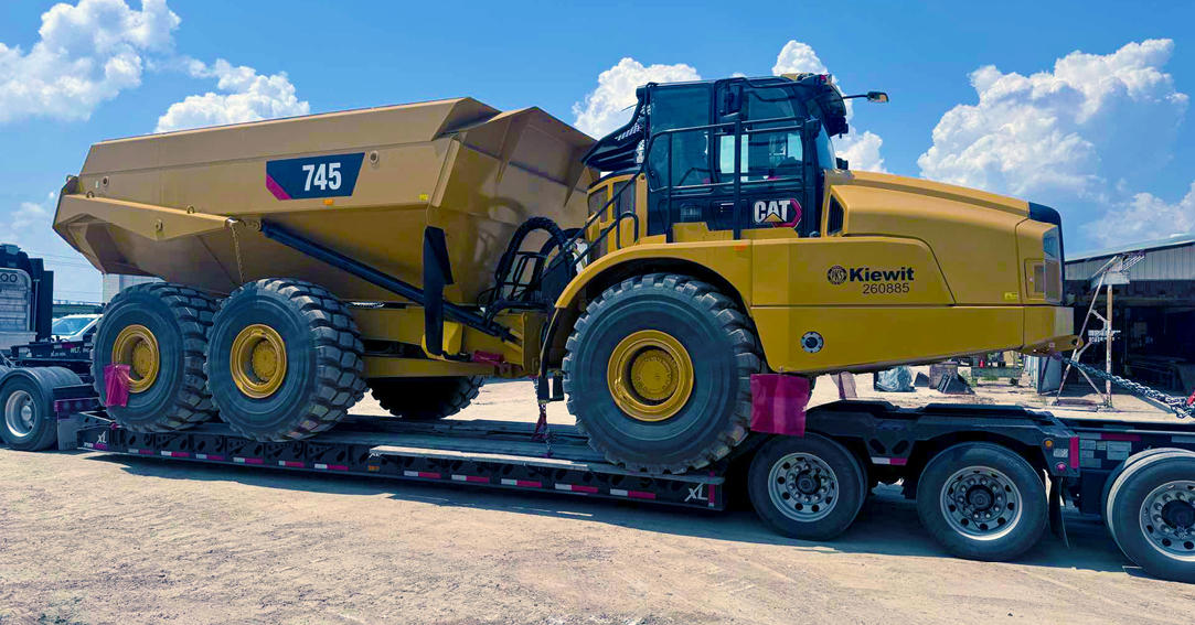 Buchanan Logistics uses their heavy haul trailer to transport construction equipment and materials to a jobsite.