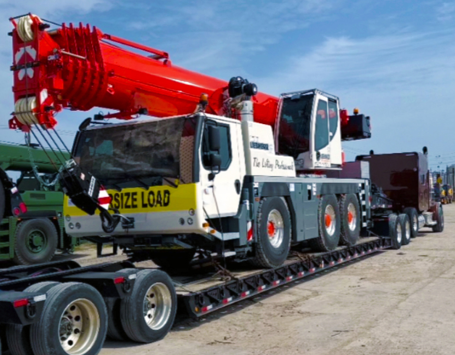 Buchanan Logistics transporting a mobile crane to a jobsite for a construction crew.