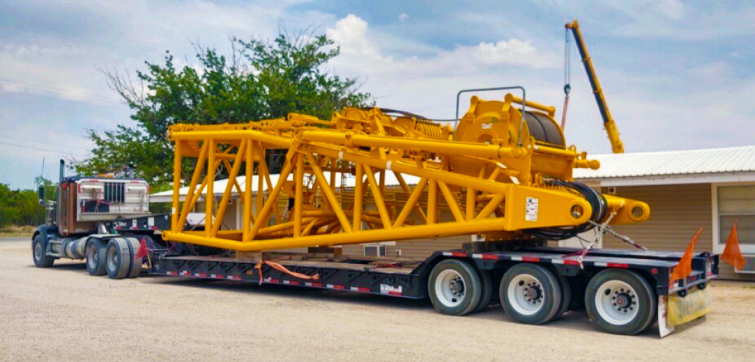 Buchanan Logistics transporting a section of a crane to a jobsite for a construction crew.