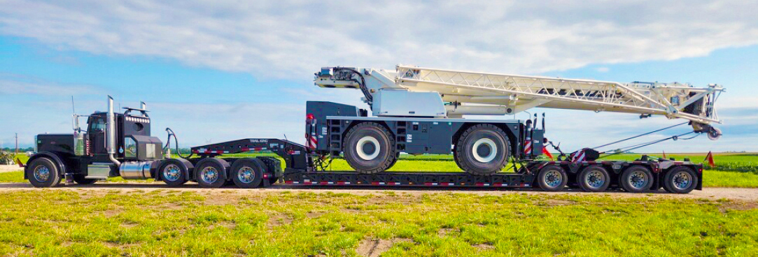Buchanan Logistics transporting a mobile crane to a jobsite for a construction crew.