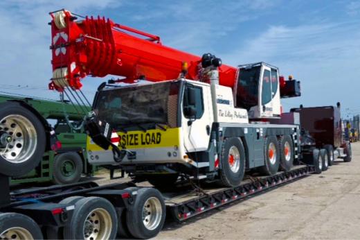 Buchanan Logistics transporting a mobile crane to a jobsite for a construction crew. Buchanan Logistics transporting a mobile crane to a jobsite for a construction crew.