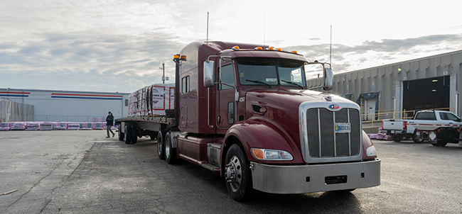 Buchanan Logistics, Inc. transports building materials like roofing shingles and wood frames for contractors.