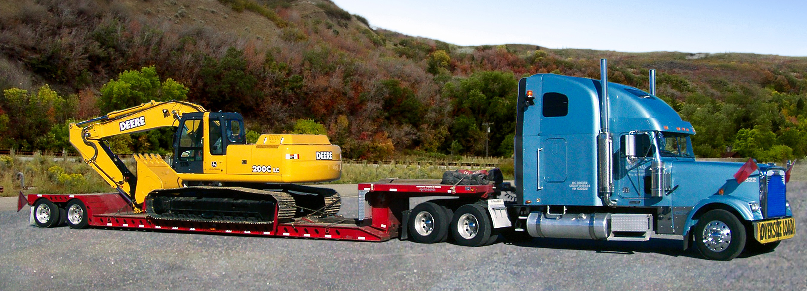 Construction machinery being taken to a site for use, and with Buchanan Logistics providing the transport.