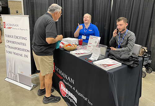 Buchanan recruiters talk with potential truck drivers and administrative professionals.