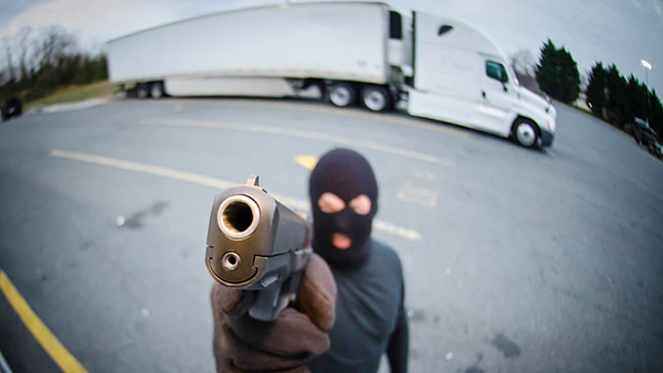 A thief is willing to use violence against a truck driver when stealing freight.