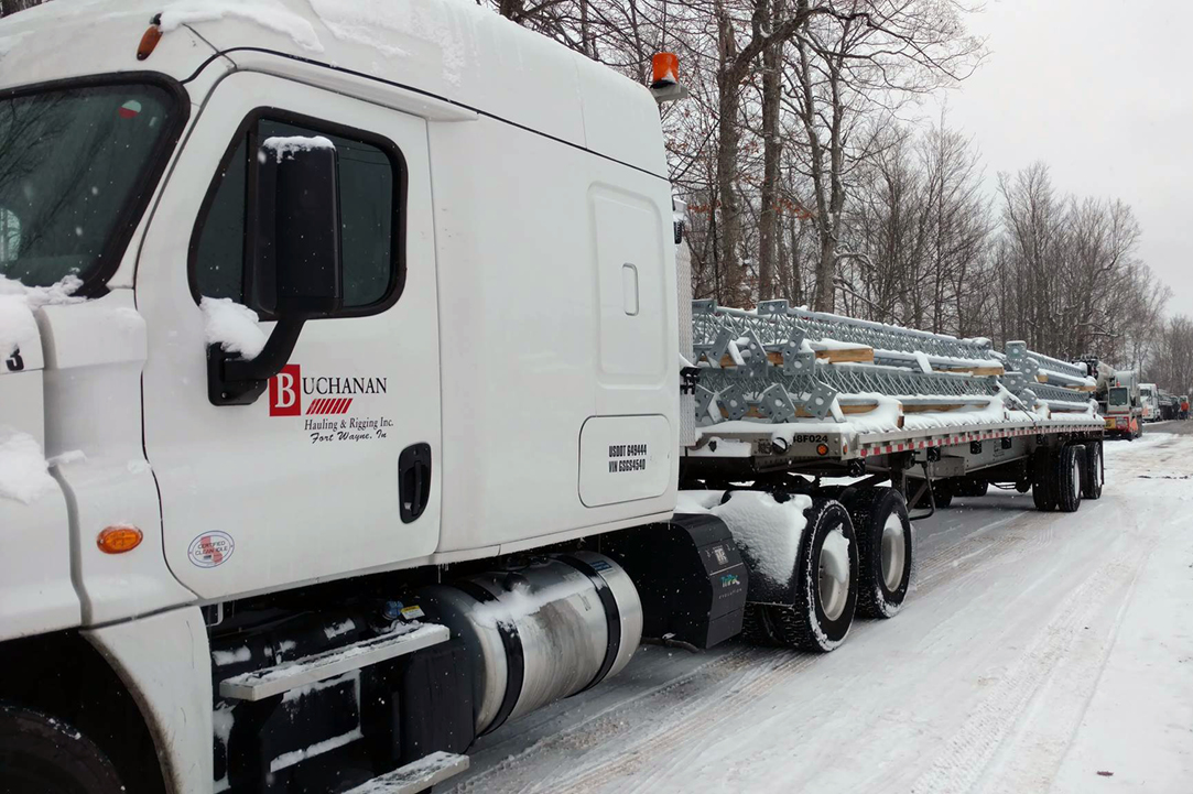 Buchanan flatbed driving safely through winter conditions.